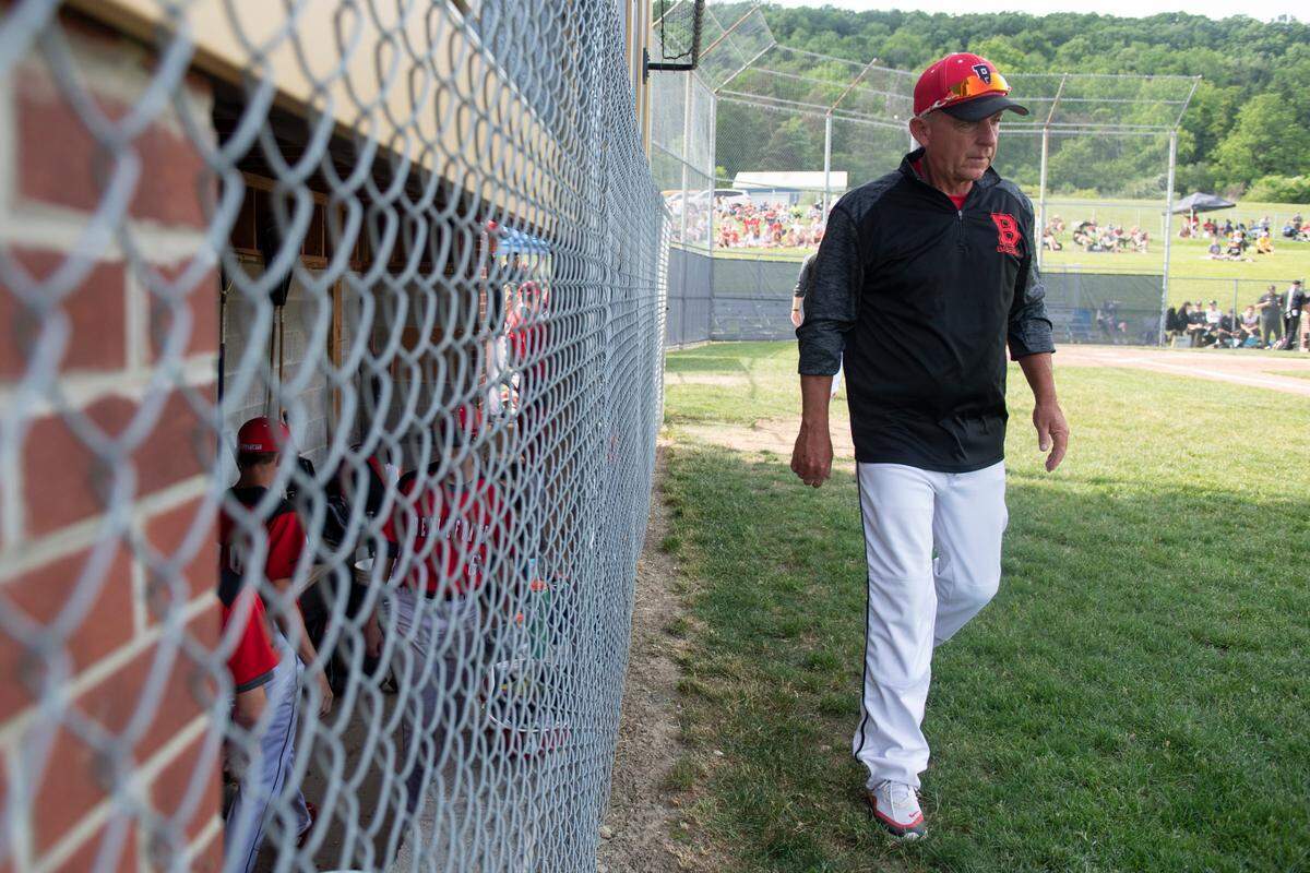Assistant coach Rick Hall walks past the dugout during the PIAA Class 4A Baseball Championships between Bellefonte Area High School and Montour High School at Bald Eagle Area High School on June 6, 2022 in Wingate, Pa. Bellefonte Area High School fell to Montour High School 13-9.