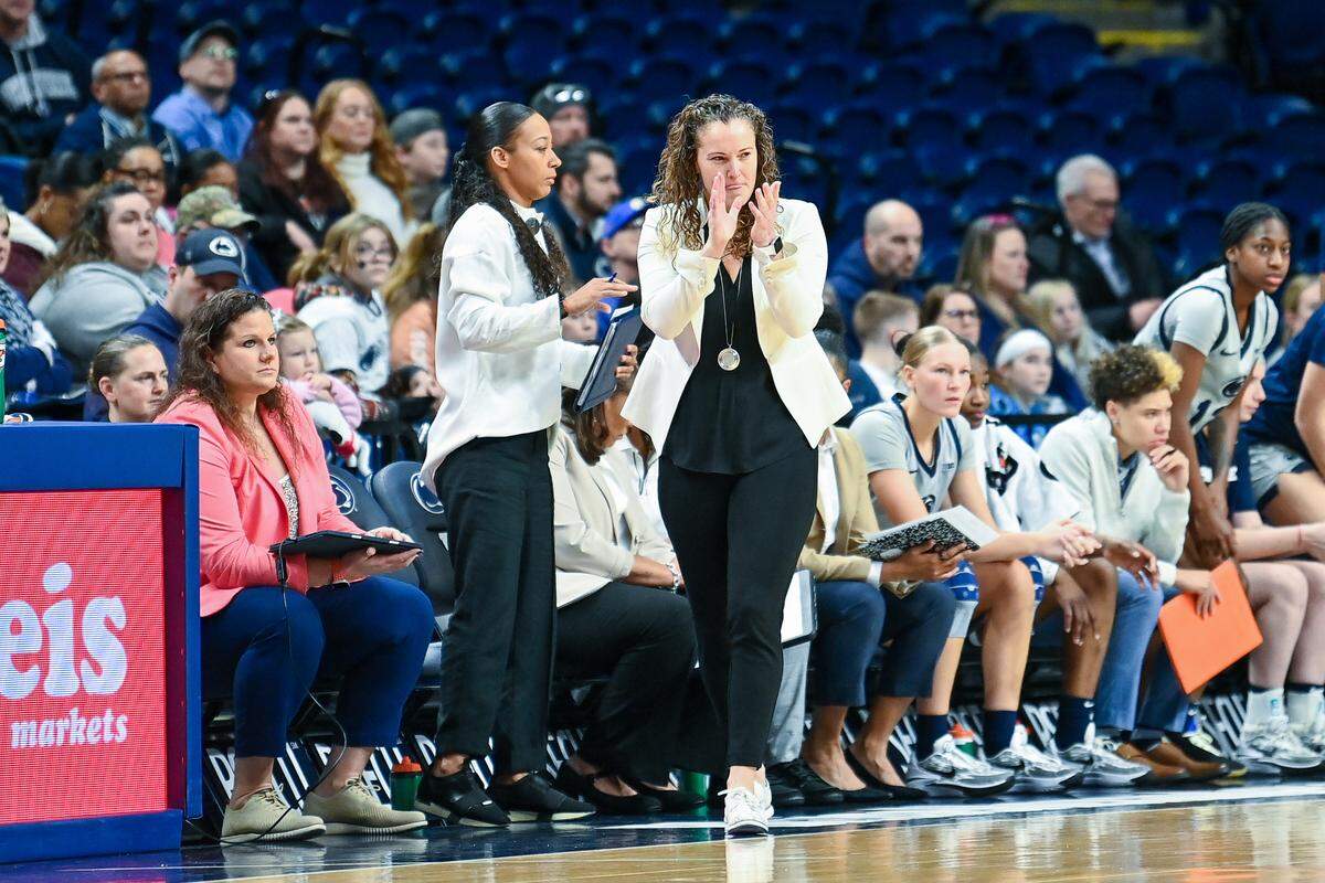 Penn State women’s basketball head coach Carolyn Kieger claps during Sunday’s match up against Nebraska.