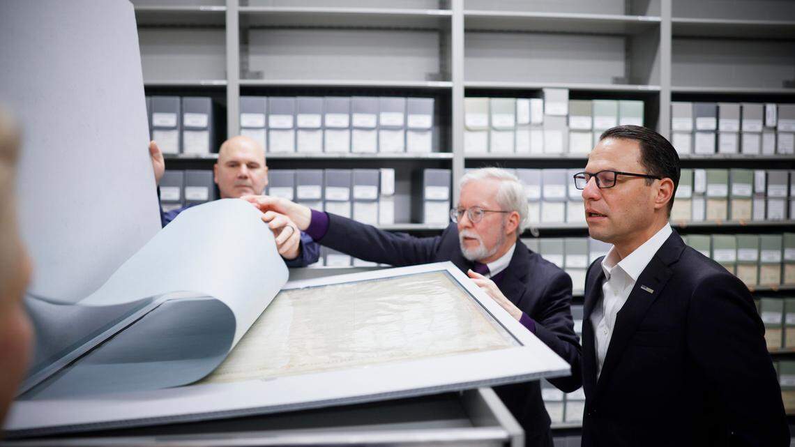 Officials from the Pennsylvania Historical & Museum Commission show Gov. Josh Shapiro the new Pennsylvania State Archives building.