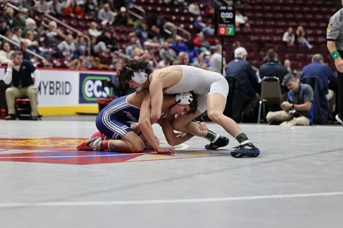Penns Valley’s Colten Shunk looks to finish off a shot of Camp Hill’s Noah Doi in their 133-pound second round consolation match of the PIAA Class 2A Championships on Friday, March 10, 2023 at the Giant Center in Hershey. Doi beat Shunk, 7-2.