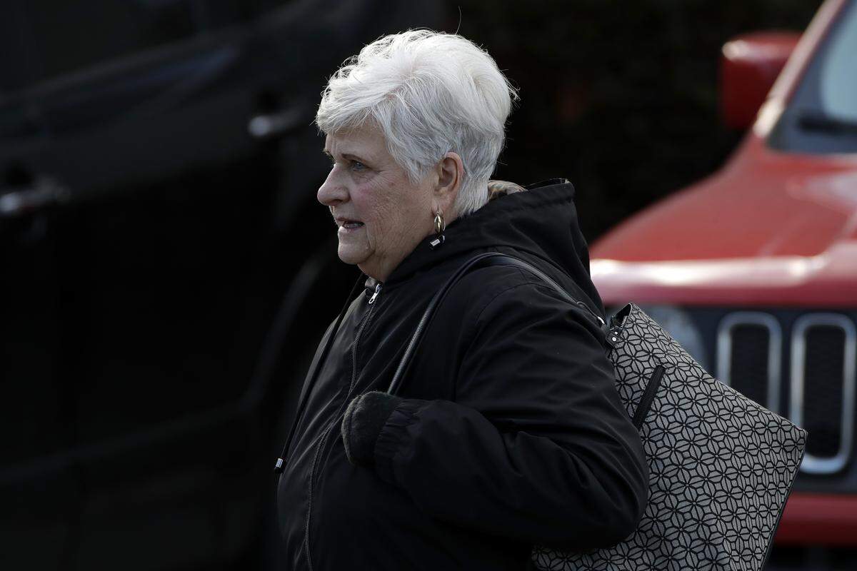 The wife of former Penn State University assistant football coach Jerry Sandusky, Dottie Sandusky, leaves the Centre County Courthouse after attending a resentencing hearing on his 45-count child sexual abuse conviction Friday.
