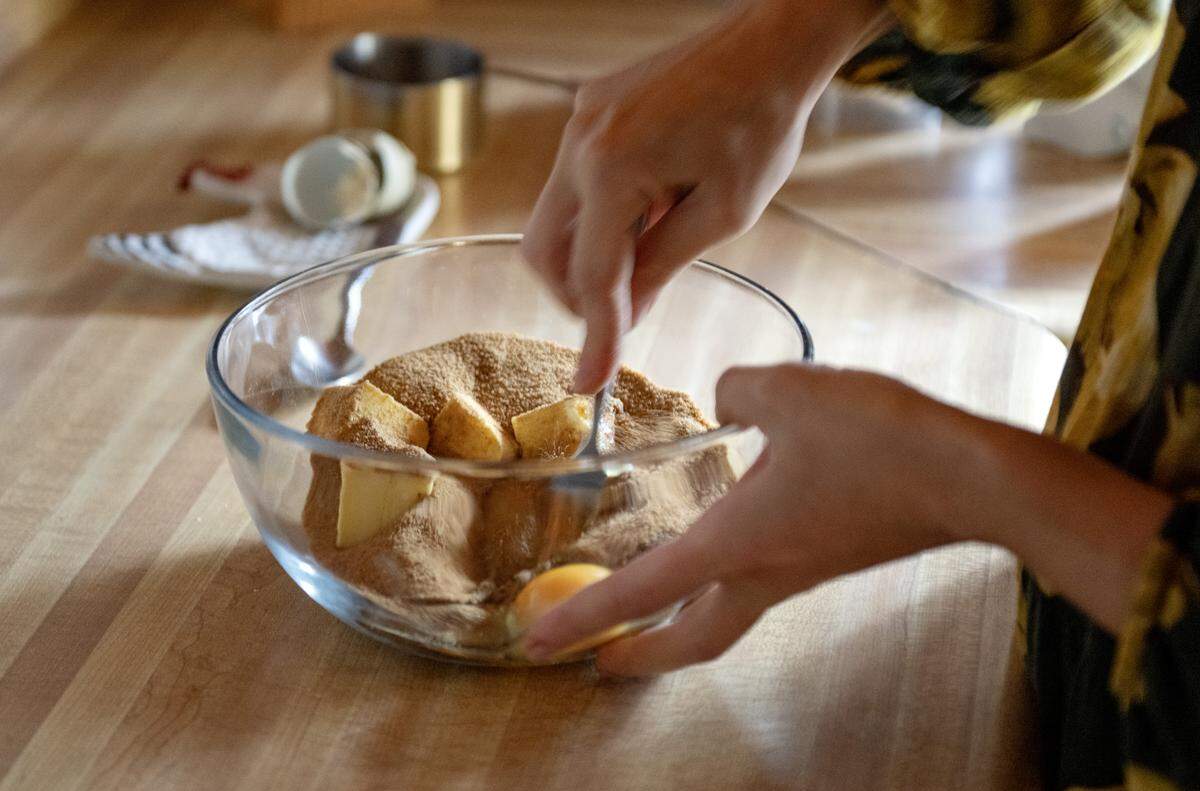 Alyssa Burns of Blackberry Cottage Bake Shoppe mixes batch of chocolate chip cookies on Friday, Nov. 14, 2025. 