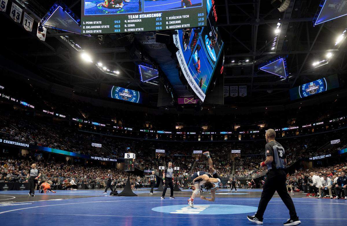 Penn State's Braeden Davis controls West Virginias’ Jordan Titus in a 141-pound bout at the NCAA wrestling championships on Friday, March 20, 2026.