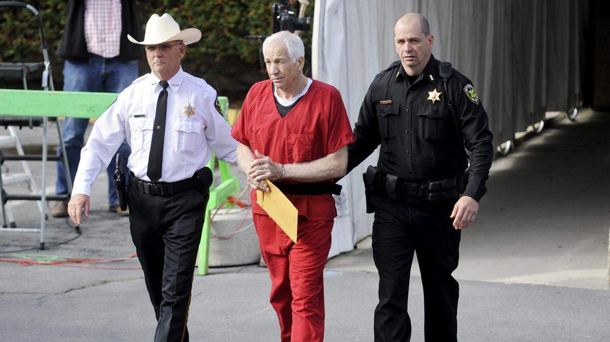 Jerry Sandusky leaves the Centre County Courthouse after sentencing in October 2012.