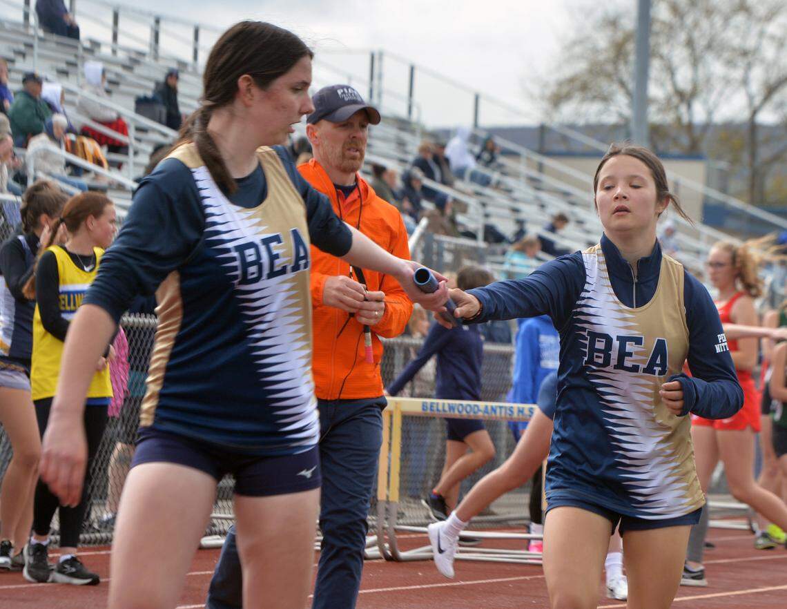 Bald Eagle Area’s Lily Spicer,right, hands off to Danyka Smith in the 3200 relay at Bellwood High School Monday during the Bellwood Invitational track meet on Monday, May 1, 2023.