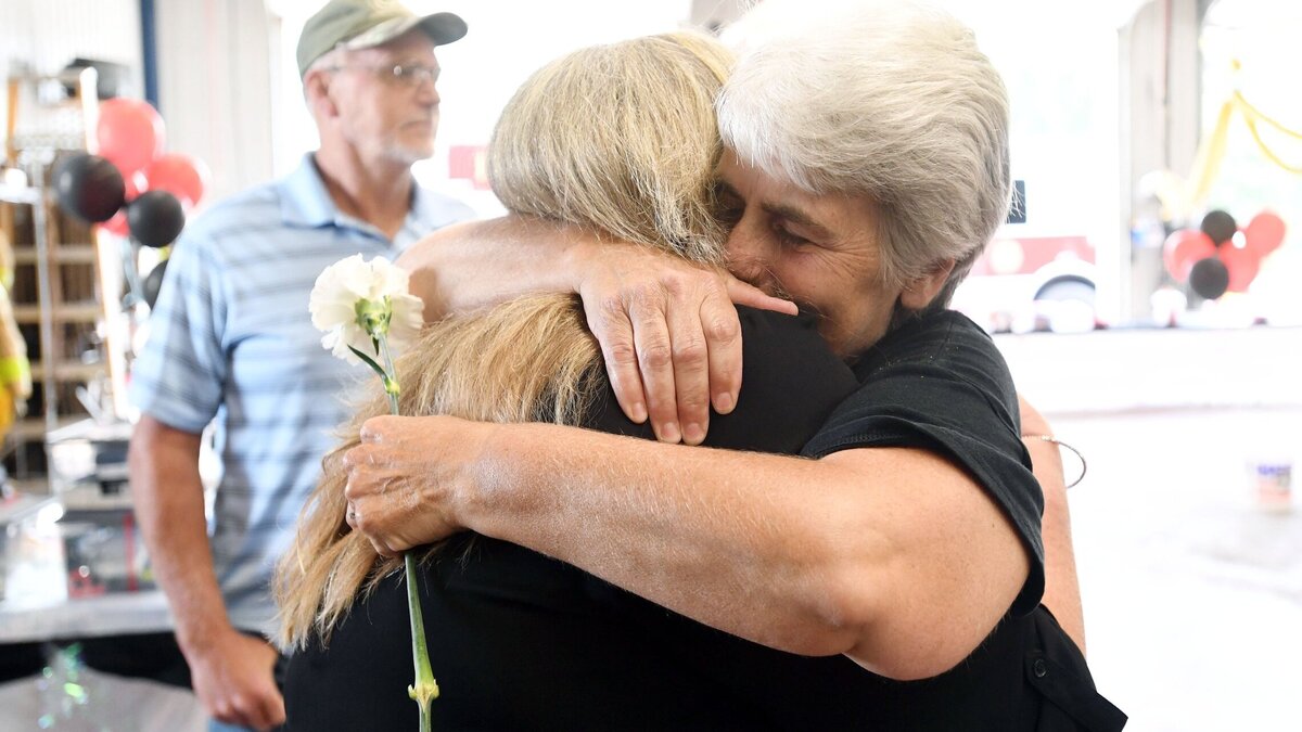Deb Bell hugs Port Matilda Fire Company member Gail Witherite during a thank you party for firefighters Saturday, Aug. 25, 2018, at the Port Matilda Fire Company.