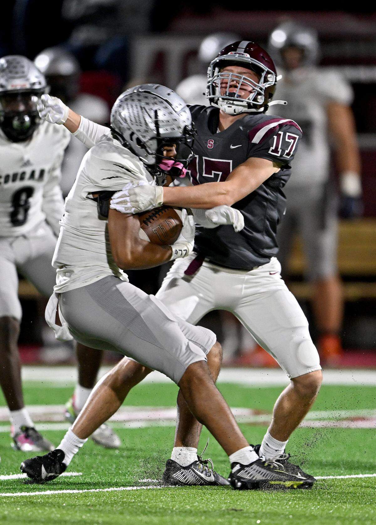 State College’s Adison Dillon stops Harrisburg’s ball carrier during the game on Friday, Oct. 13, 2023.