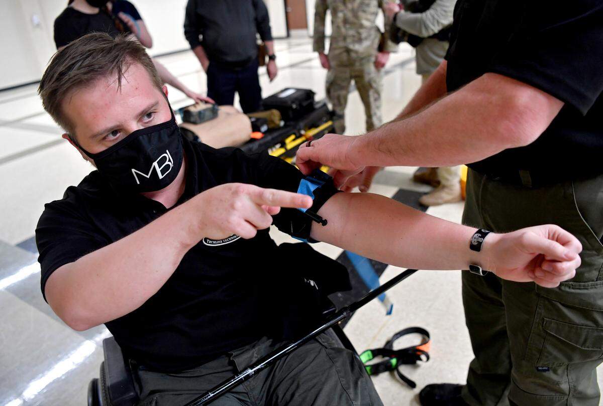 Adam Hartswick talks about the approved types of tourniquets during a Techline training class on March 28 at the US Army Reserve Center in Pleasant Gap.