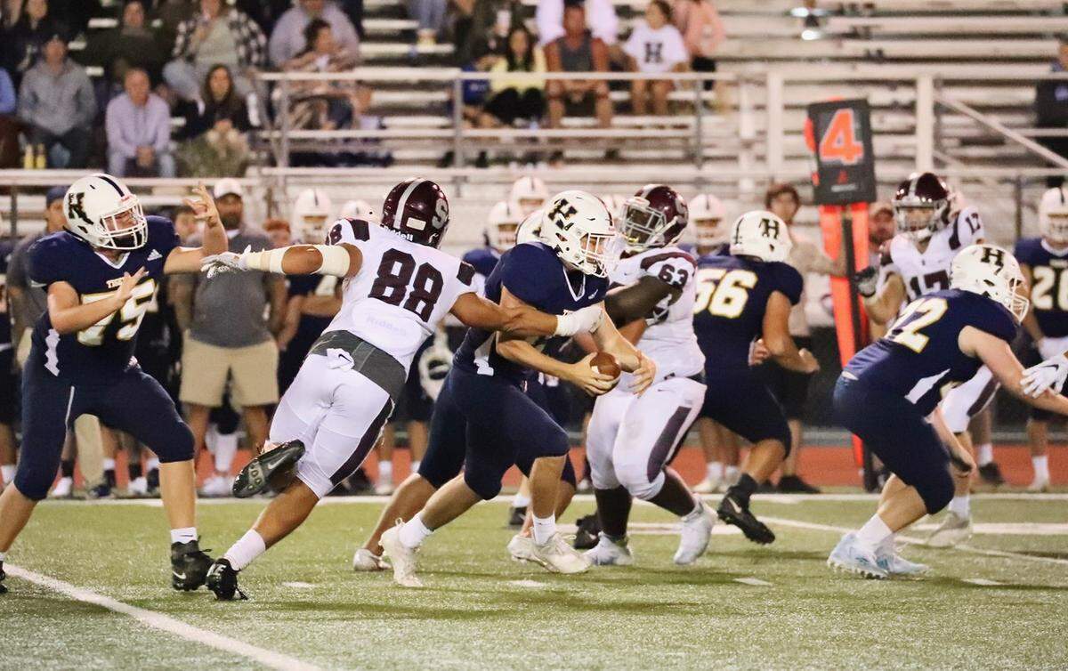 State College’s Stephen Scourtis look to stop a Hollidaysburg ball carrier on Friday, Sept. 10, 2021. State College won, 34-20.