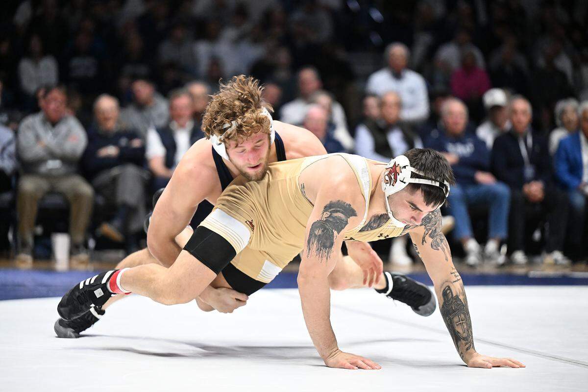 Penn State's Connor Mirasola (top) takes down Lehigh's Remy Brancato at 197 pounds during the Sunday, Dec. 7, 2025 match at Rec Hall in State College. Mirasola defeated Brancato, 8-3. Penn State defeated Lehigh, 36-6.