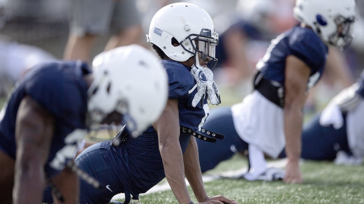 Penn State wide receiver KJ Hamler stretches with his teammates for practice on Sunday, Dec. 30, 2018 at Celebration High School. For the last practice of the season players traded jerseys with a teammate.