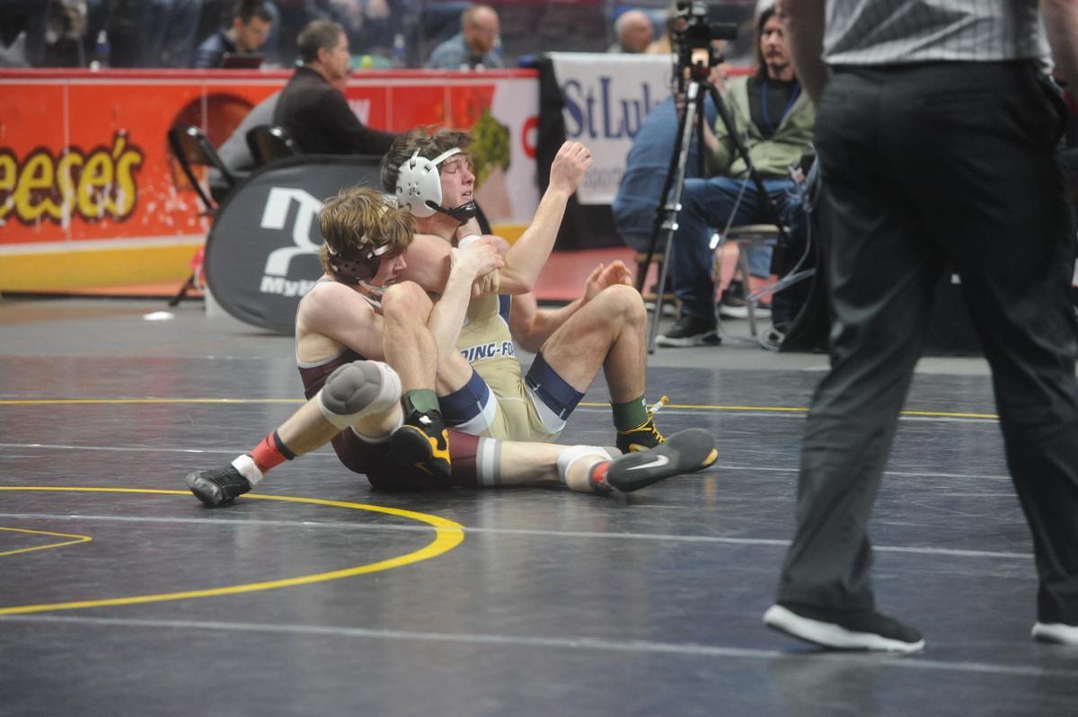 State College’s Hayden Cunningham rocks Spring-Ford’s Quinn Smith back in a crossface cradle during their 127-pound first round match of the PIAA Class 3A Championships on Thursday, March 9, 2023 at the Giant Center in Hershey. Cunningham pinned Smith in 50 seconds.