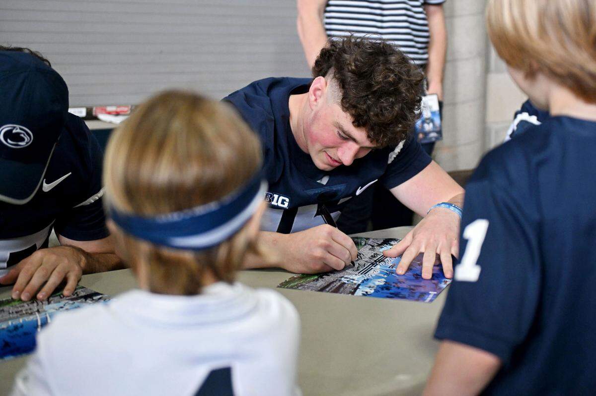 Penn State quarterback Drew Allar signs autographs before the Blue-White game on Saturday, April 26, 2025 at Beaver Stadium.