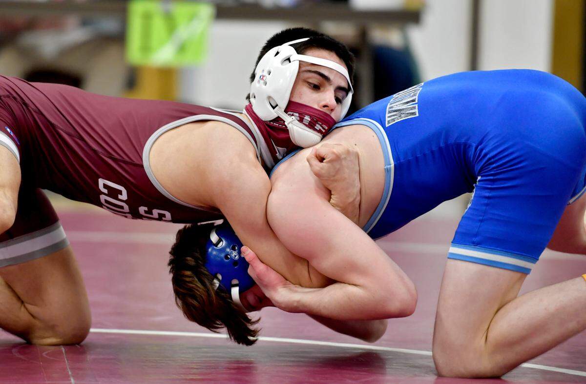 State College’s Owen Woolcott and Central Mountain’s Luke Simcox face off in the 126 lb championship bout at the District 6 3A tournament on Friday, Feb. 19, 2021 at Altoona High School.