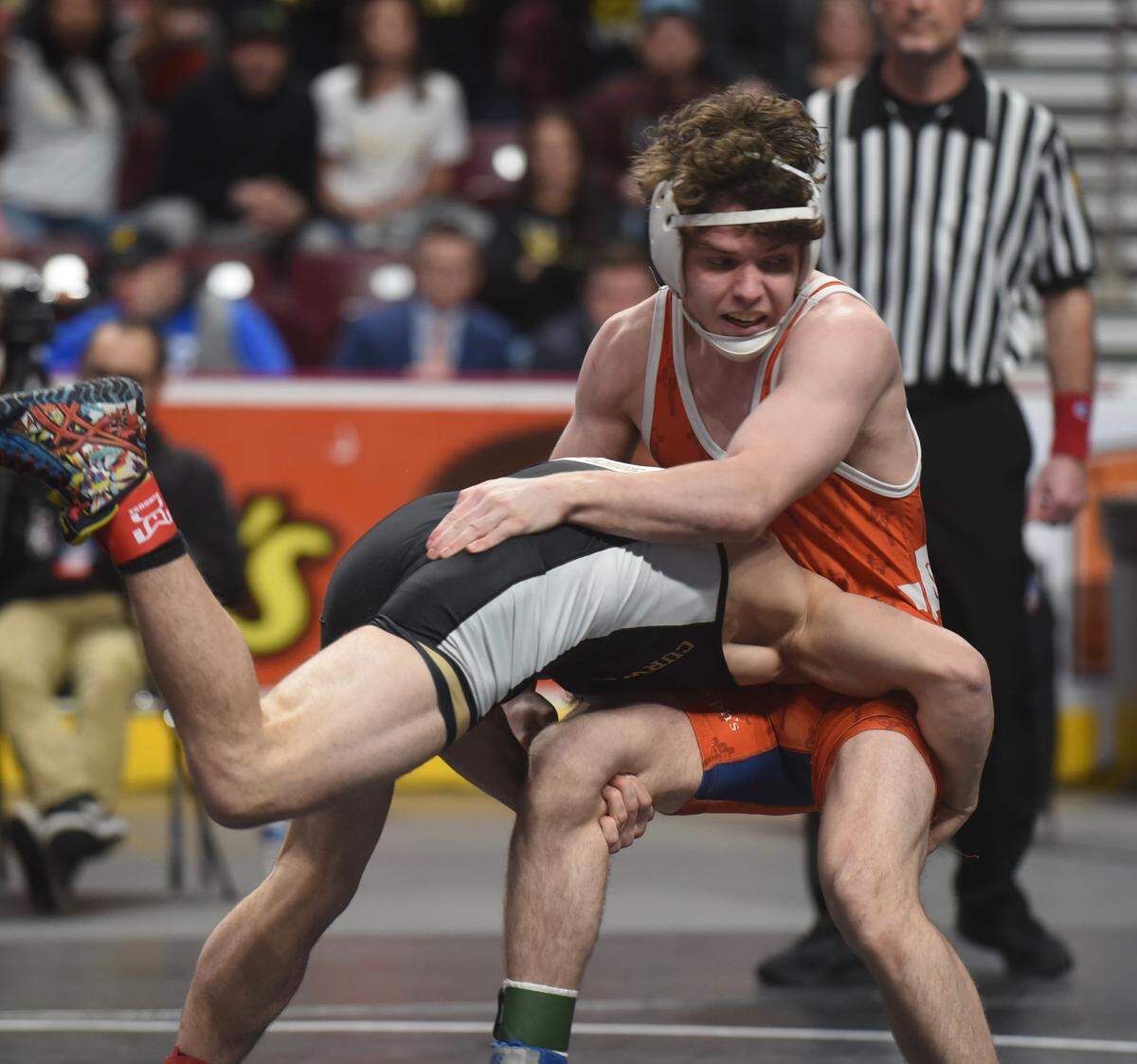 St. Joseph’s Catholic Academy’s Zack Witmer fights off a takedown attempt from Curwensville’s Zach Holland in their 138-pound fifth-place match. Witmer won 8-0.
