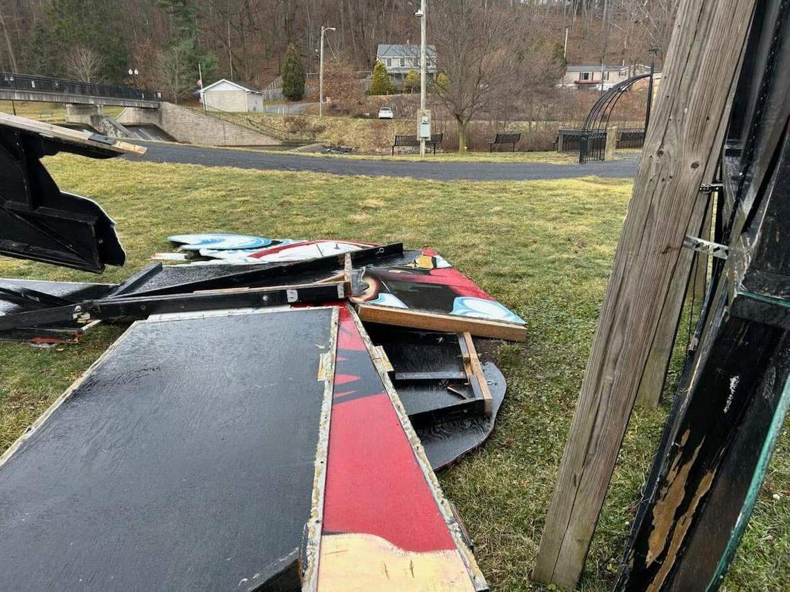 Pieces of the large Santa Claus display on the ground following its collapse.