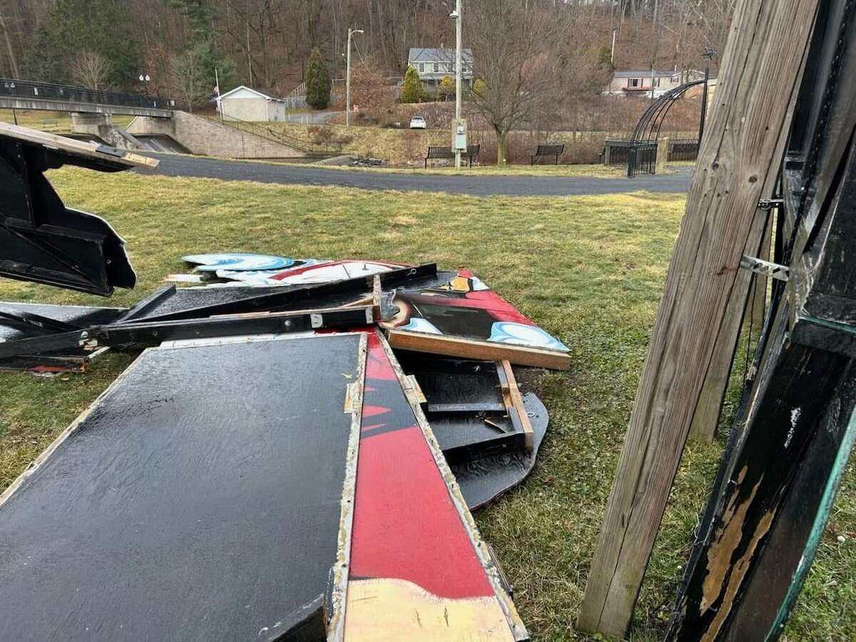 Pieces of the large Santa Claus display on the ground following its collapse.