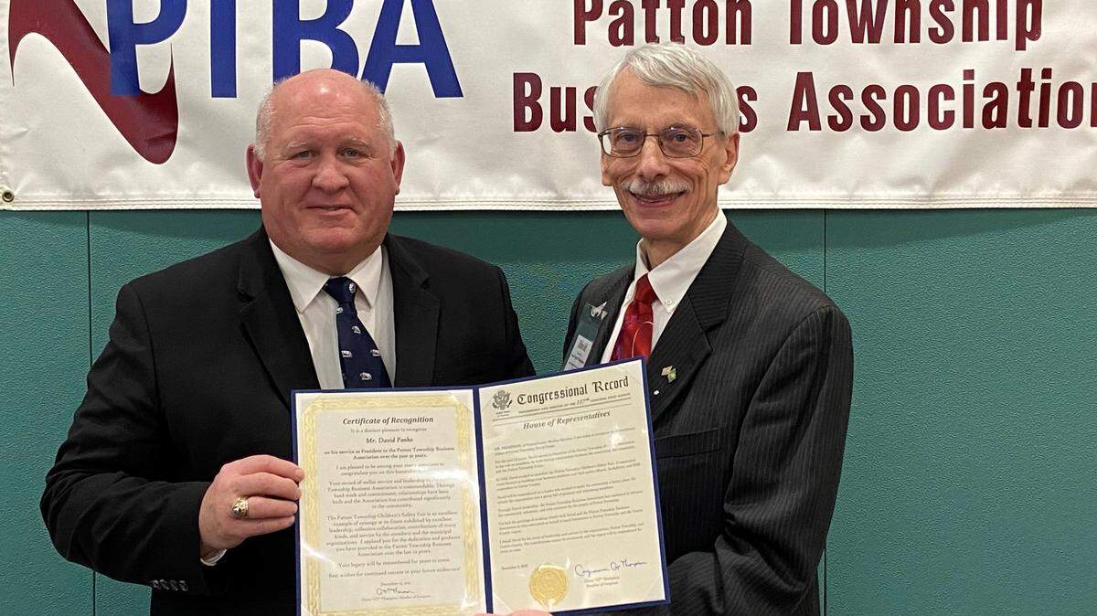 U.S. Rep. Glenn Thompson, R-Howard Township, left, recognizes outgoing Patton Township Business Association President David Panko on Wednesday during a PTBA meeting.