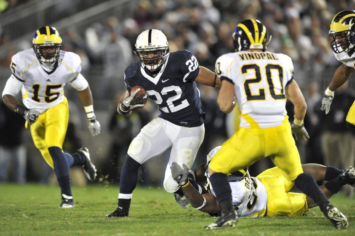Evan Royster runs through the Michigan defense in the second half. Penn State beat Michigan 41-31 October 30, 2010. CDT/Nabil K. Mark