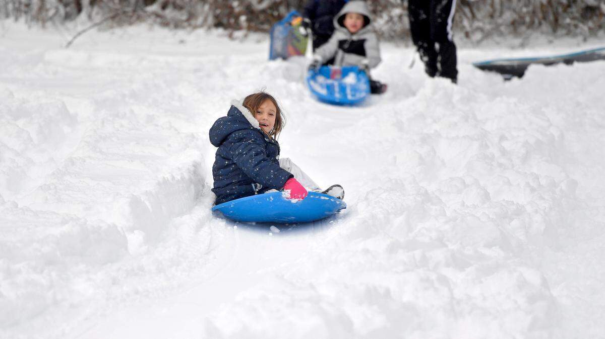 Rory Malcolm, 6, spins as she sleds at Slab Cabin Park with her family on Dec. 17, 2020.