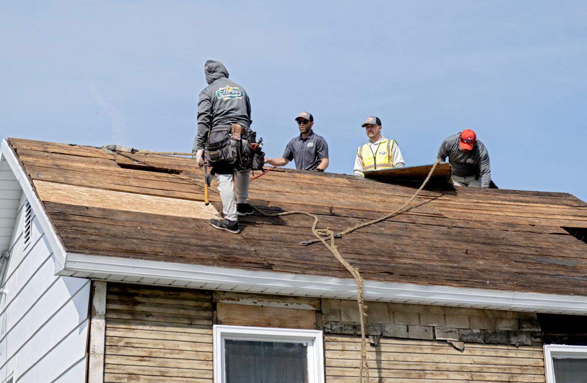 Starway Roof Systems puts a new roof on an Army veteran’s home in Clarence on Thursday, May 1, 2025 thanks to Owens Corning Roof Deployment Project.