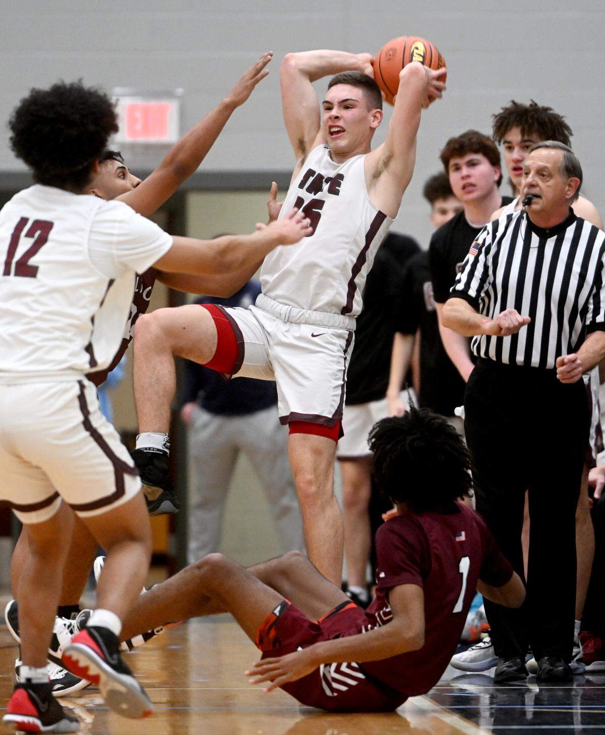 State College’s Isaac Dye throws the ball inbounds during the District 6 6A championship game at Mount Aloysius College on Friday, Feb. 24, 2023.