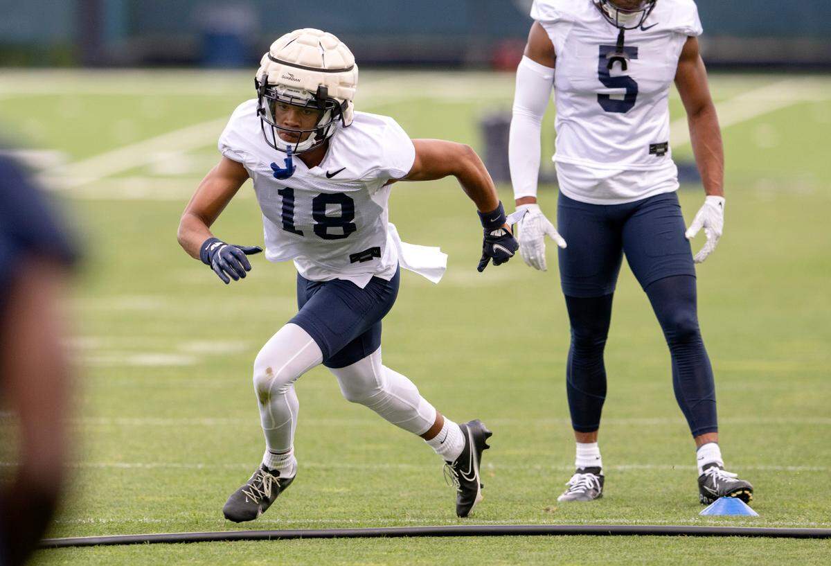 Penn State wide receiver Omari Evans runs a drill during the first day of practice on Monday, Aug. 1, 2022.