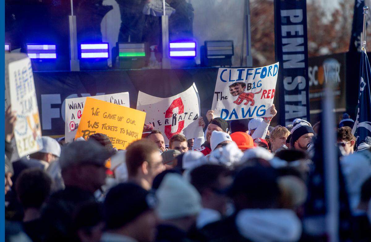 Fans cheer as and hold up signs for Fox Big Noon Kickoff Show outside of Beaver Stadium on Saturday, Oct. 29, 2022.