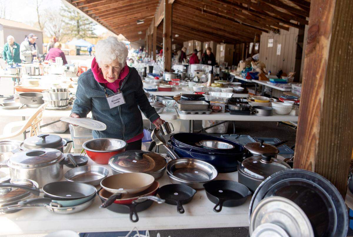 Residents prepare for the Foxdale Village yard sale on Thursday, April 28, 2022.