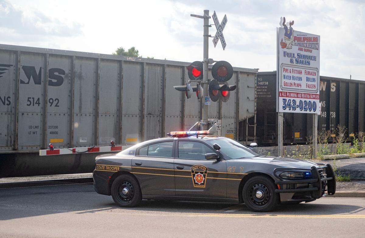 A train blocks Chester Hill via the bridge at West Maple Street on the Philipsburg side on Wednesday, July 31, 2024.