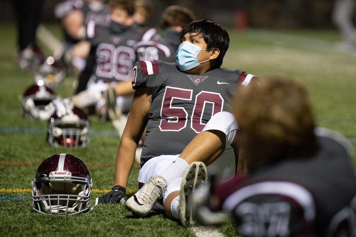 State College’s Andres Anderson stretches before State College’s game against Hollidaysburg at Memorial Field on Friday, Nov. 13, 2020 in State College.