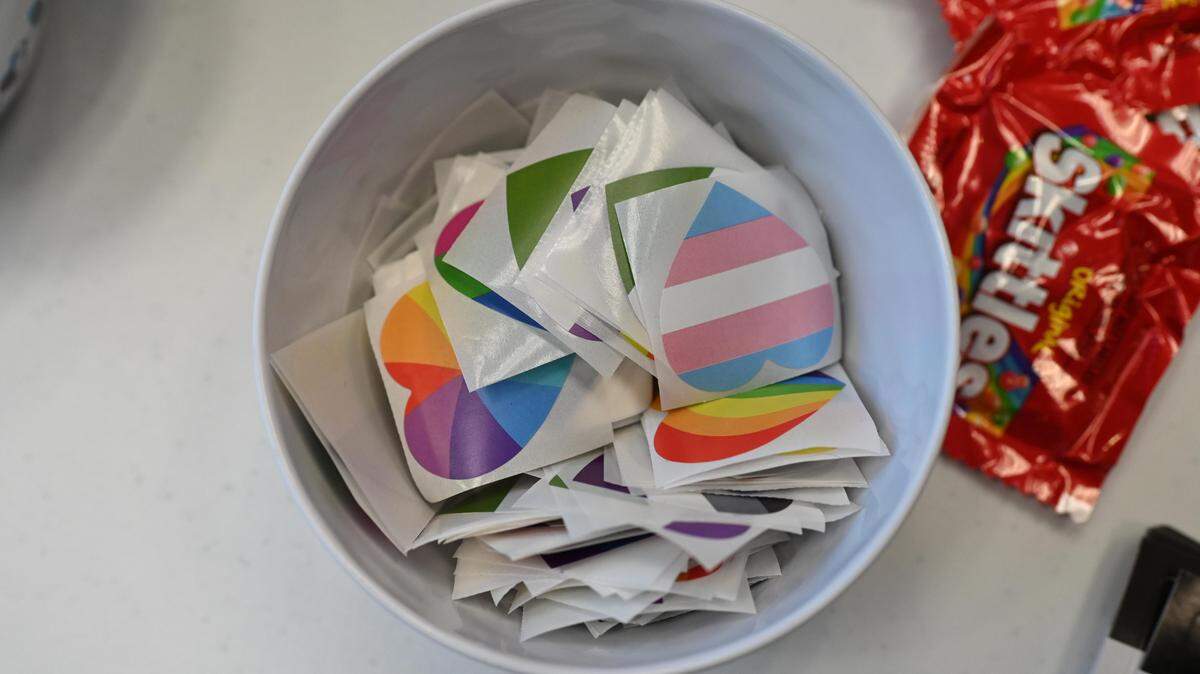 Pride stickers sit in a bowl during the National Coming Out Day celebration at Penn Valley Elementary School on Wednesday, Oct. 9, 2024.