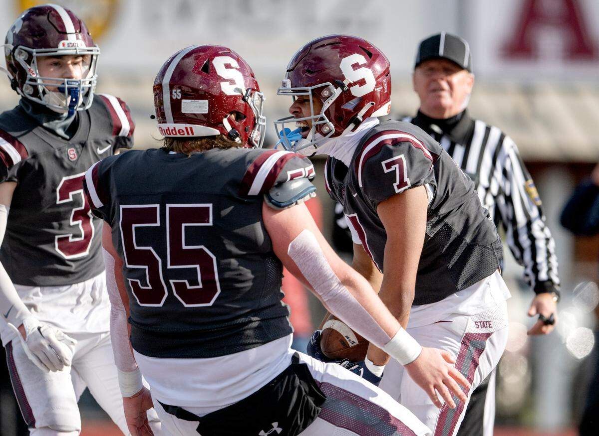 State College’s D’Antae Sheffy celebrates his touchdown during the PIAA 6A semifinal game against Harrisburg at Mansion Park on Saturday, Dec. 3, 2022.