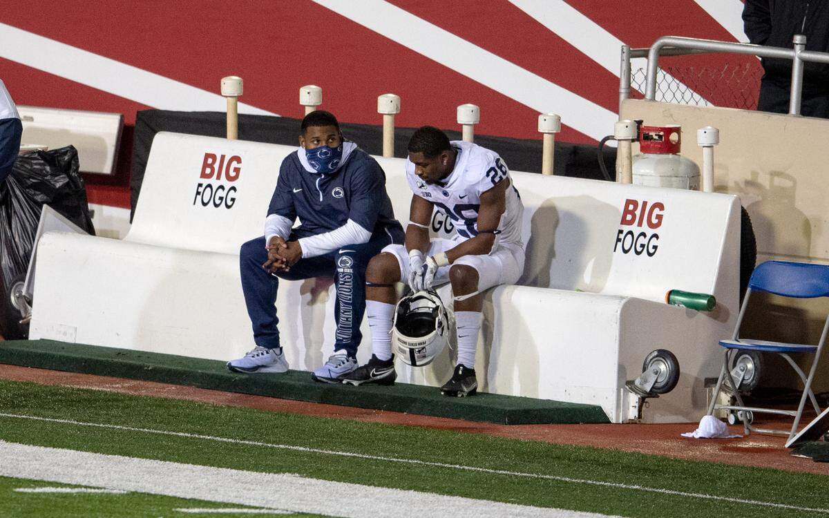 Penn State running back Devyn Ford sits in disappointment with teammate Journey Brown next to him as the clock winds down on the regulation game against Indiana on Saturday, Oct. 24, 2020 at Memorial Stadium. Ford scored a touchdown in the fourth quarter giving Indiana the ball back to tie, and win in overtime.