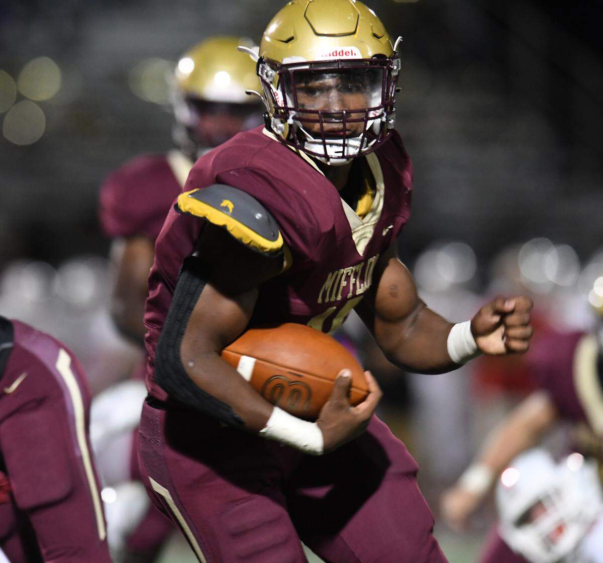 Governor Mifflin’s Nick Singleton runs with the ball during a game.