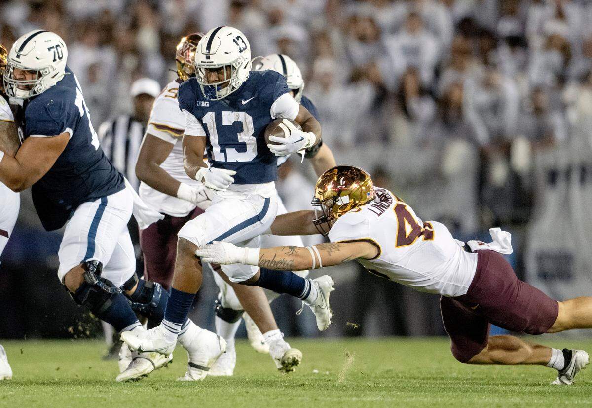 Minnesota defenders try to stop Penn State running back Kaytron Allen during the game on Saturday, Oct. 22, 2022.