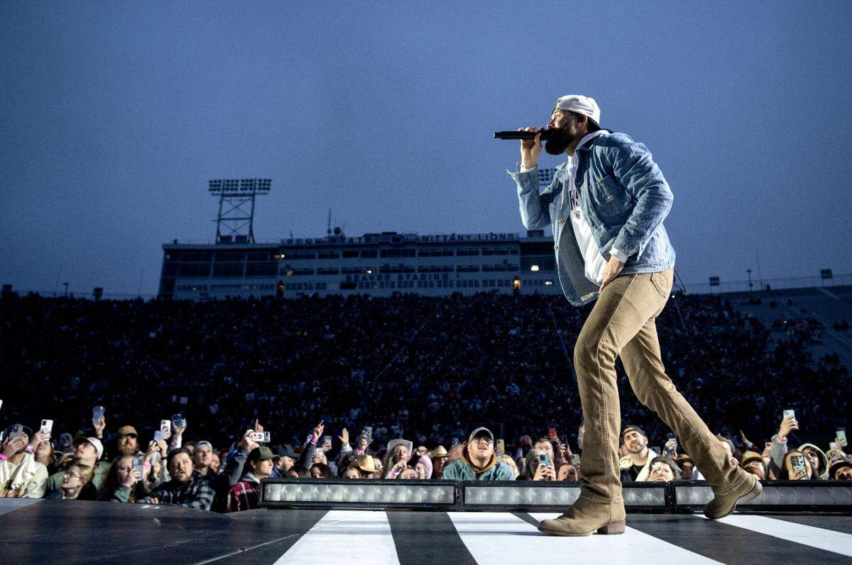 Fans cheer and sing along as Jordan Davis performs at Beaver Stadium before Luke Combs on Saturday, April 27, 2024.
