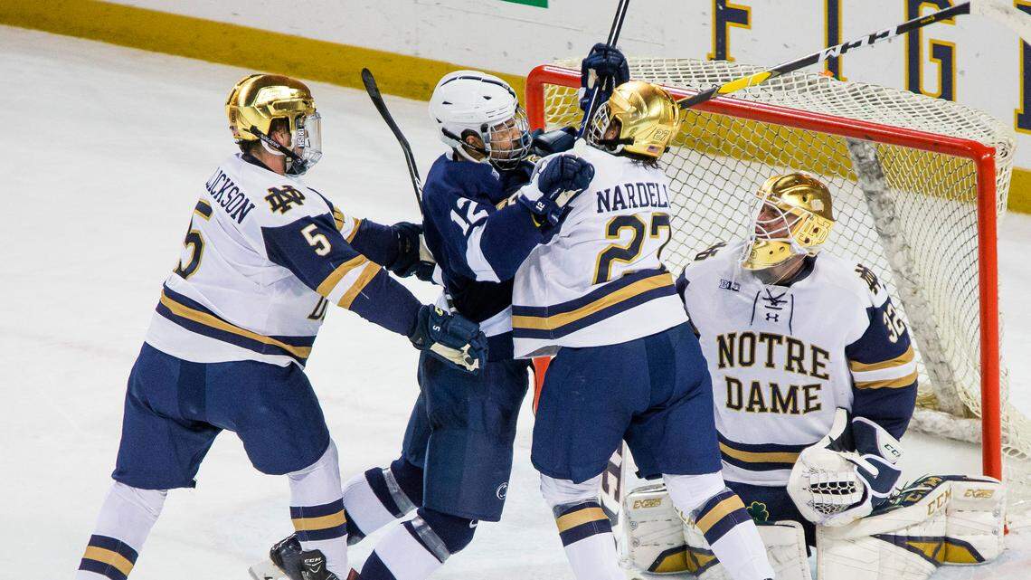 Notre Dame’s Matt Hellickson and Bobby Nardella get tied up with Penn State’s Ludvig Larrison as goalie Cale Morris watches in the Big Ten men’s hockey tournament championship game Saturday, March 23, 2019, in South Bend, Ind. (Michael Caterina/South Bend Tribune via AP)