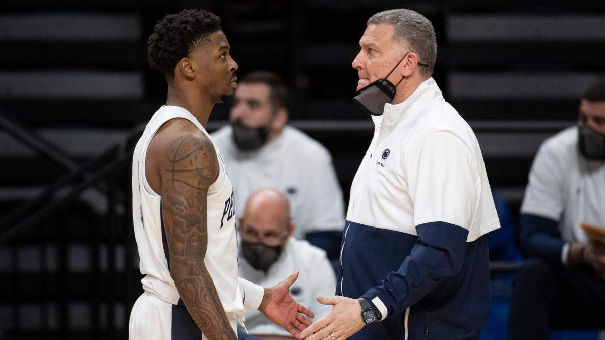 Penn State’s Jamari Wheeler high fives Penn State interim men’s basketball coach Jim Ferry during Penn State men’s basketball’s game against No. 4 Ohio State at the Bryce Jordan Center on Feb 18, 2021 in University Park, PA.