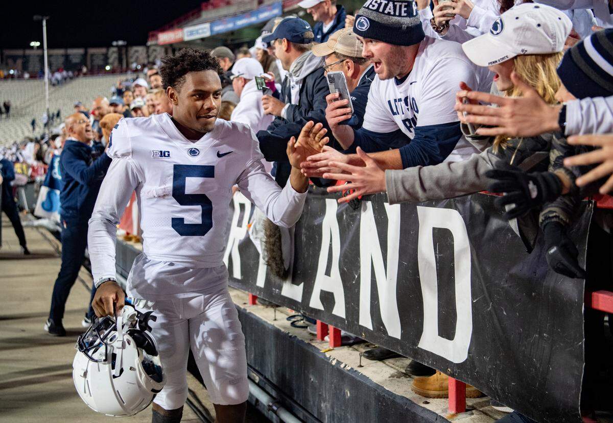 Penn State wide receiver Jahan Dotson high fives fans after the win over Maryland on Saturday, Nov. 6, 2021.