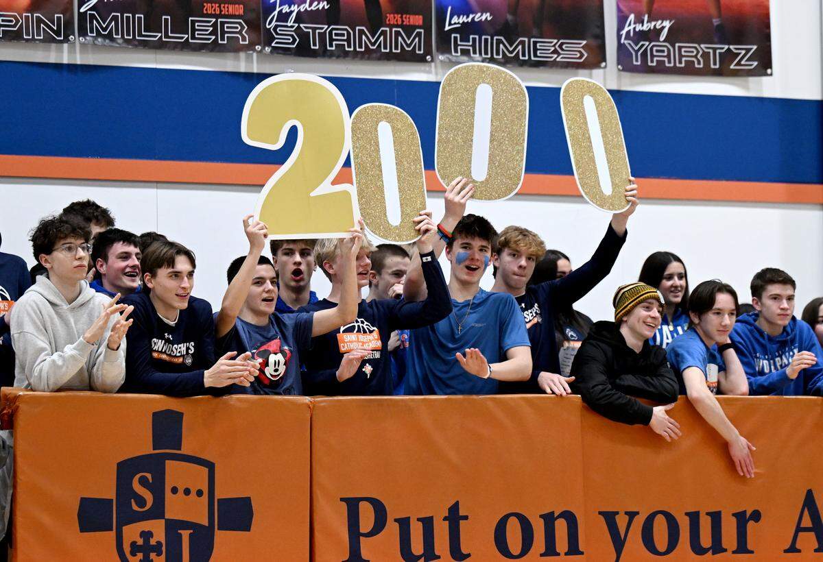 The Saint Joseph’s Catholic Academy’s student section cheers for Naomi Crispin as she gets her 2,000th point during the game against Juniata on Monday, Feb. 9, 2026.