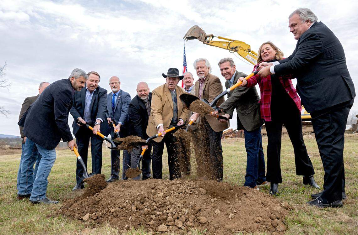 Ed Maxwell, far left, shovels dirt in the groundbreaking ceremony for the new Home2 Suites by Hilton hotel off of Shiloh Road in College Township on Tuesday, Nov. 19, 2024.