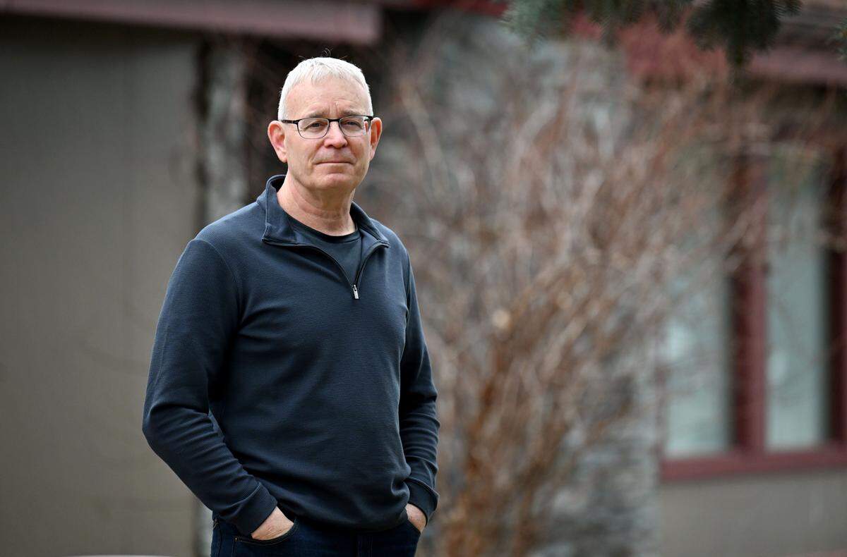 Rick Weyer stands in front of his home on Thursday, March 19, 2026. His well water was contaminated by PFAS. 