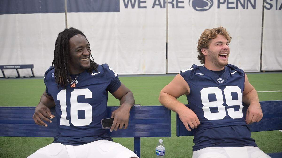 Penn State tight ends Khalil Dinkins and Finn Furmanek laugh as they try their best Nittany Lion roar impressions during media day on Aug. 2, 2025.  