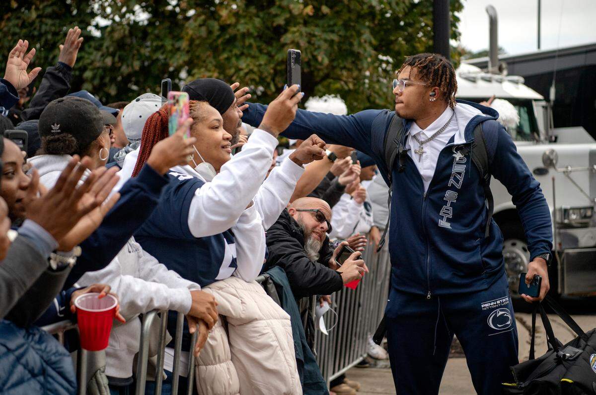 Penn State linebacker Brandon Smith greets fans as the team arrives at Ohio Stadium for the game on Saturday, Oct. 30, 2021.