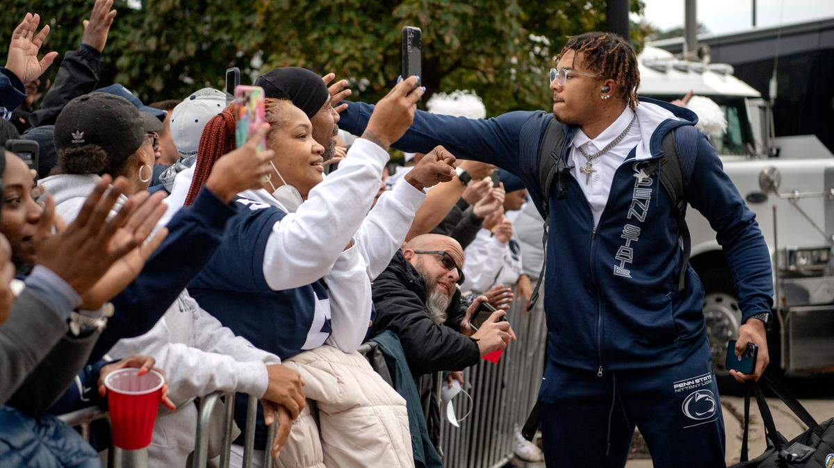 Penn State linebacker Brandon Smith greets fans as the team arrives at Ohio Stadium for the game on Saturday, Oct. 30, 2021.