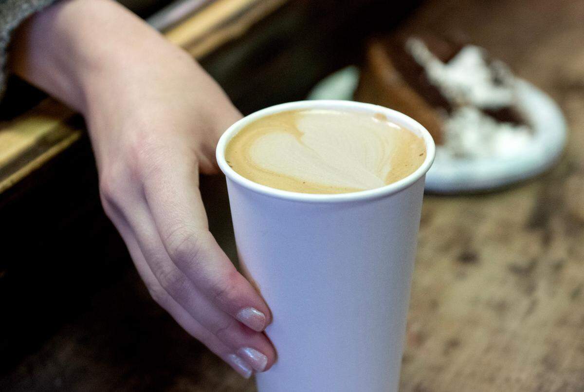 A mocha with a heart is given to a customer at The Cheese Shoppe on Monday, Feb. 10, 2025. Mo