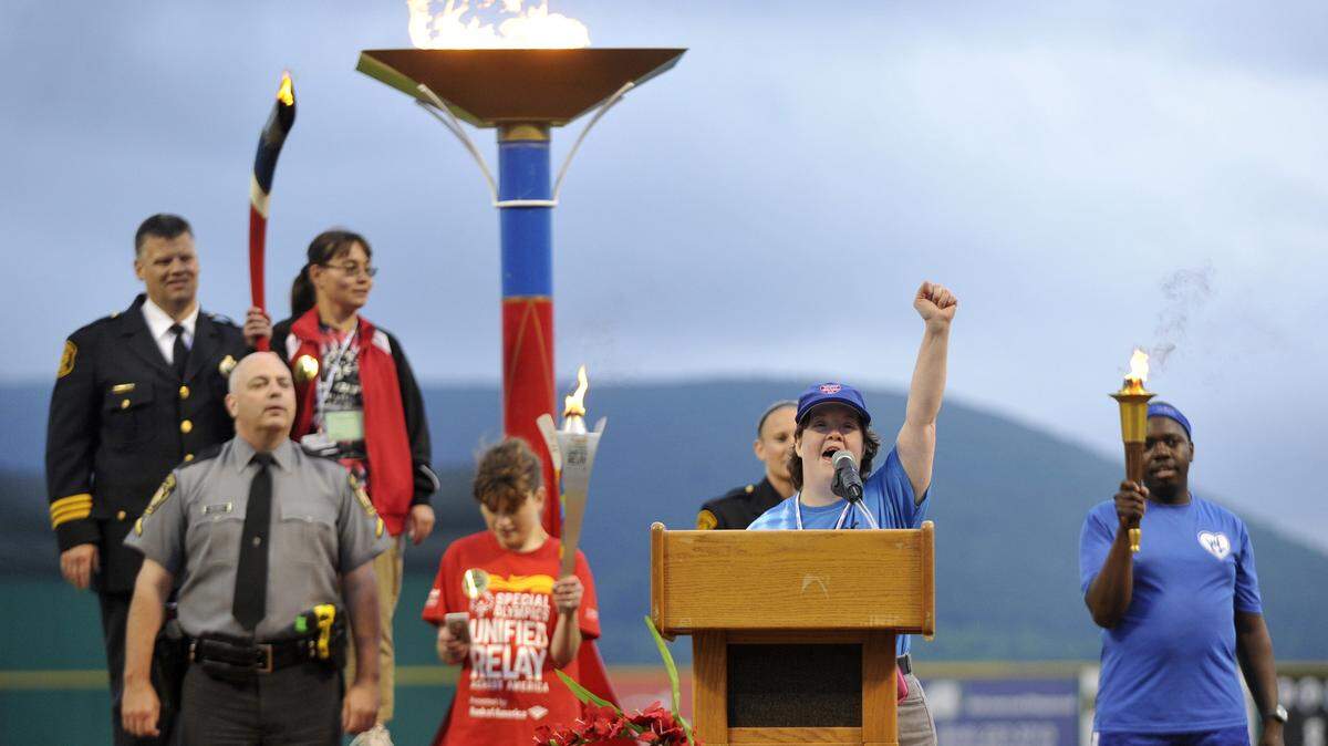 Beth Armitage, an athlete from Monroe County, leads the Special Olympics Oath at the 2015 Pennsylvania Special Olympics opening ceremonies at Medlar Field. The Special Olympics will return to Penn State next week, but more volunteers are needed.