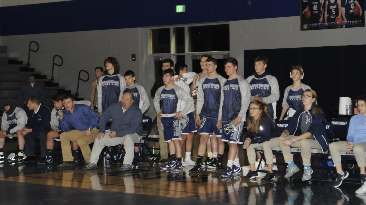 Penns Valley’s wrestling team looks on during Caelob Packer’s 220-pound match during the Rams’ 59-21 win on Friday night over Southern Huntingdon. It was Penns Valley’s first wrestling match in its’ new gym.