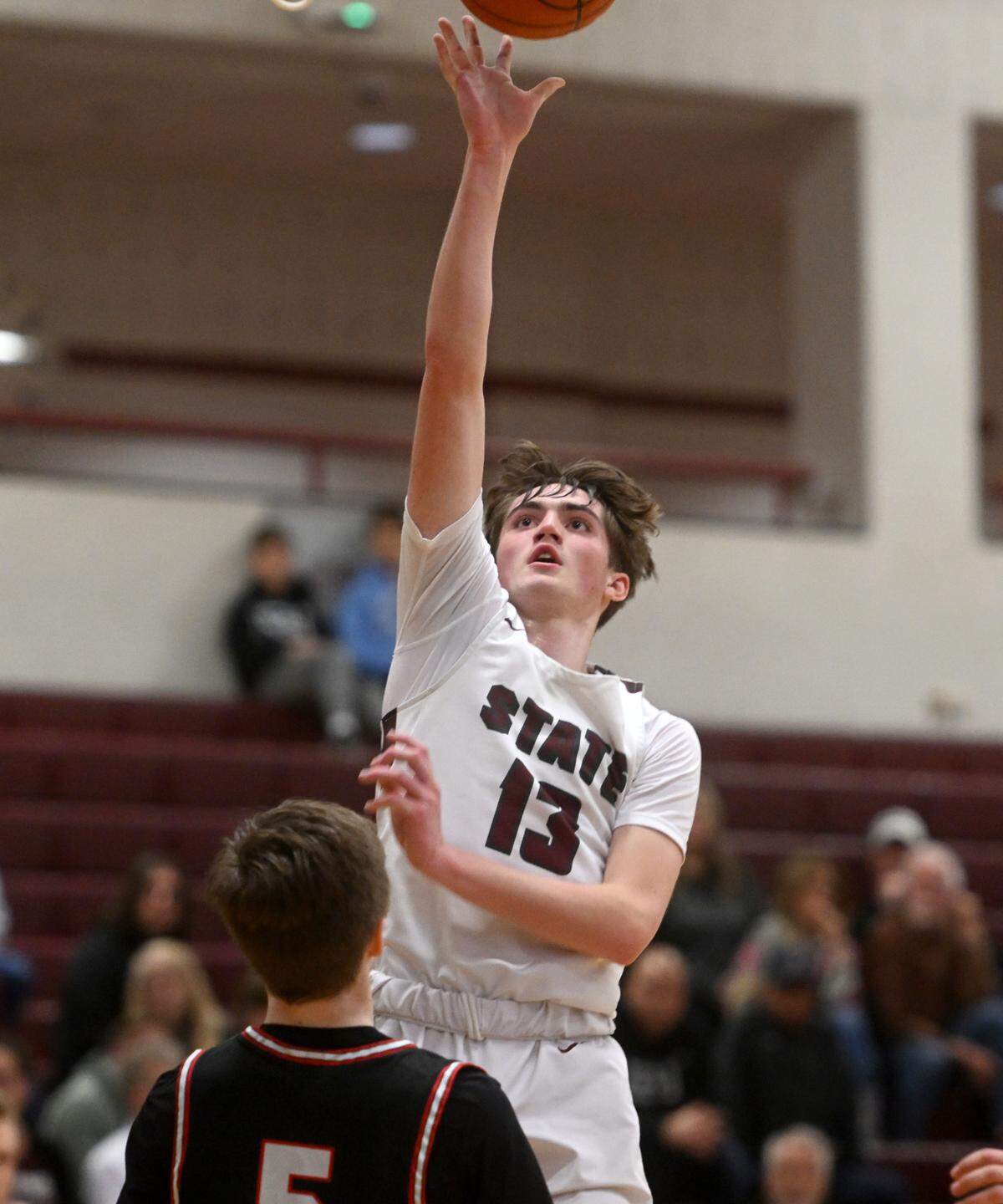 State College’s Ryan Perks goes in for a basketball during the PIAA first round game against Upper St. Clair on Saturday, March 11, 2023. State College won, 72-42.